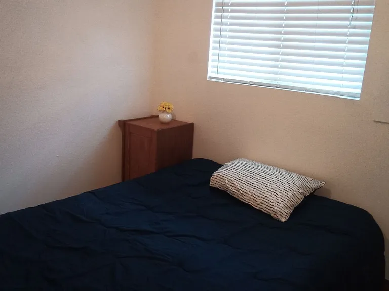Bedroom large enough for a queen bed and nightstands