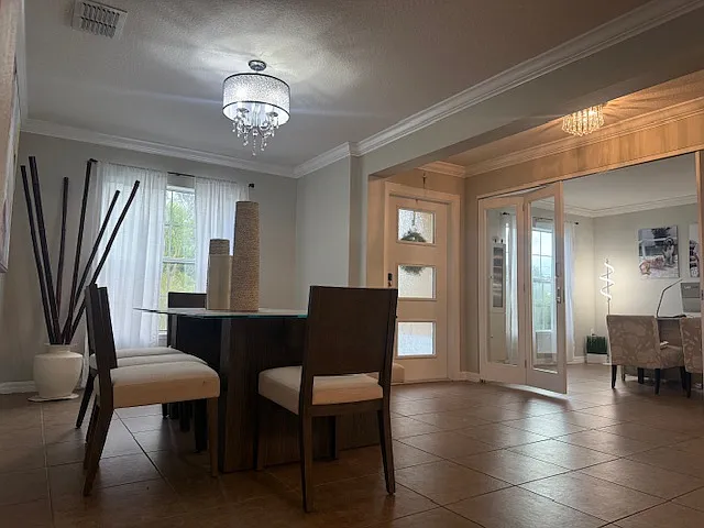 Bright and elegant dining space with an open layout, perfect for entertaining.