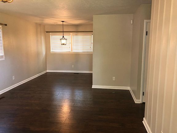 View from front door. Main living area and dining room.