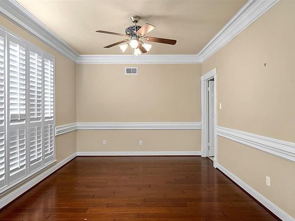Formal Dining Room to left of entry; Plantation Shutters on windows facing front of home.