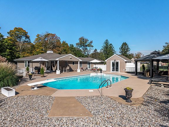 Make a SPLASH in the pool or lounge on the patio of your new home, complete with multiple seating and dining areas, and cabana with half bath.