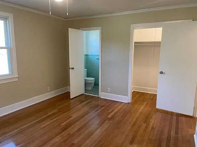 View from master bedroom to half bath and walk in closet.