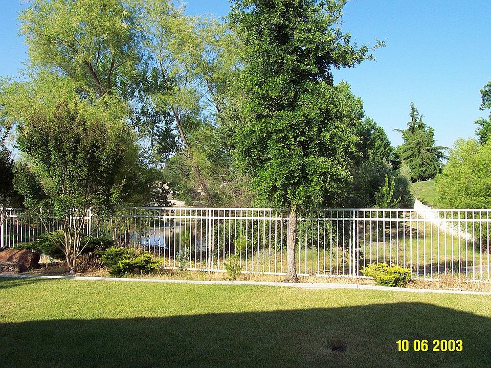 Pond at left and golf course at right.