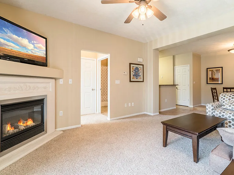 Cozy up on your couch next to the fireplace in your villa.