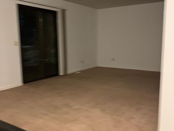 Spacious living room with sliding doors and spacious deck
