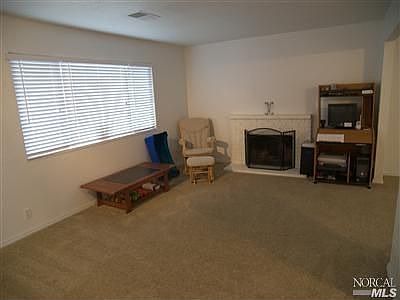 Living/Great Room with woodburning fireplace.