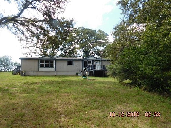 Another North view with deck to front entry.