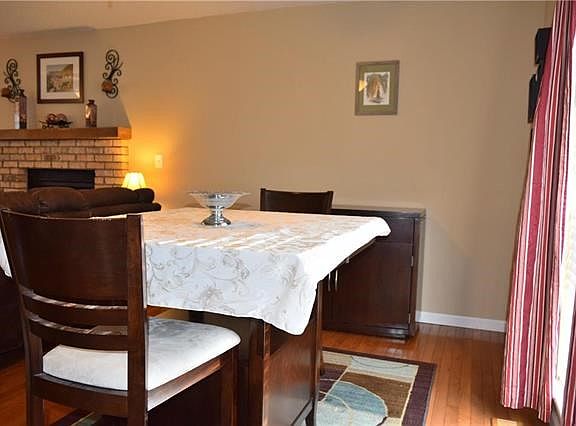 Wonderful hardwood floors flow through living room and dining room.