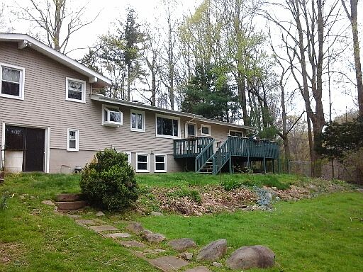 Back of home with deck