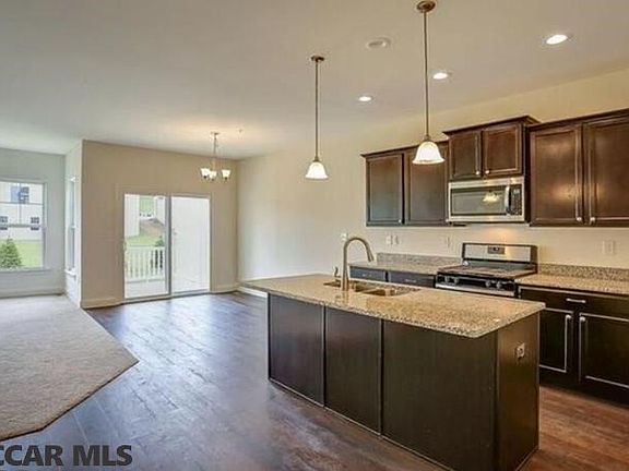 Home under construction. Completed home pictured.