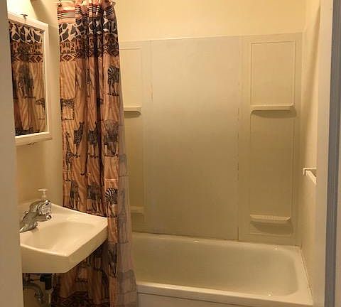 Full bathroom with tub