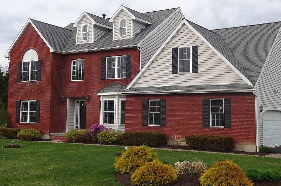 Brick and Vinyl exterior, note the dormer attic windows