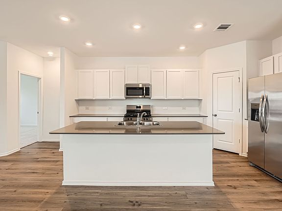 Dont miss the stainless steel appliances, central island, garbage disposal, lots of counter space in the spacious kitchen