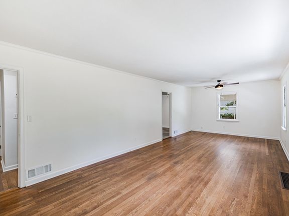 Living room. All original wood floors and windows fully restored. All new and restored doors.