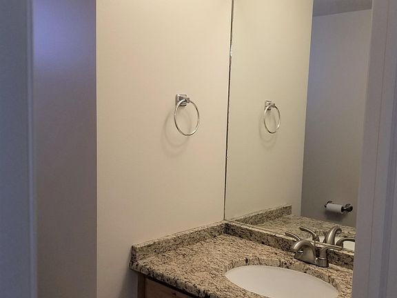 Main floor 1/4 bath.  Granite counter tops and maple cabinet