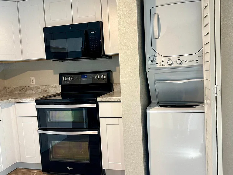 Brand new Stackable laundry center in unit