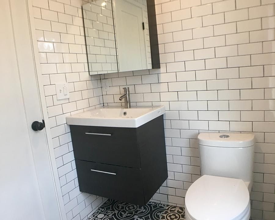 extra storage in behind mirror and 2 big drawers under sink