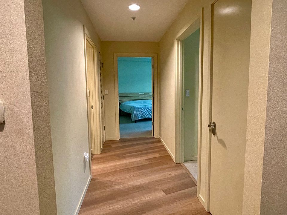 Hallway to both bedrooms and guest bathroom