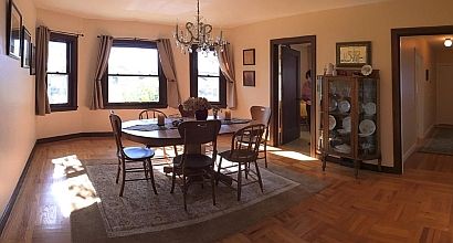 The Dining Room crystal chandelier, hardwood floors, and large bay windows provide warmth and ambience.