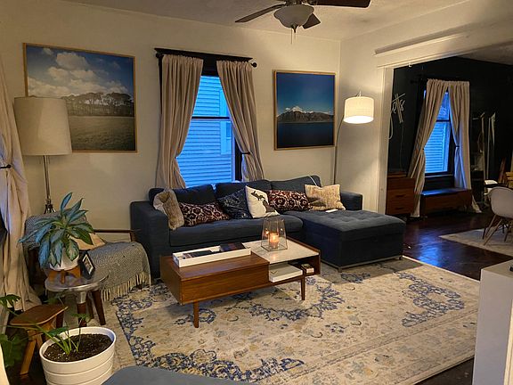 Spacious living room connected to large dining room