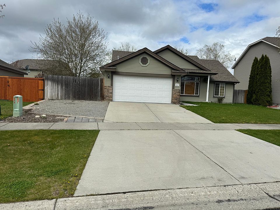 Front of home with RV parking.