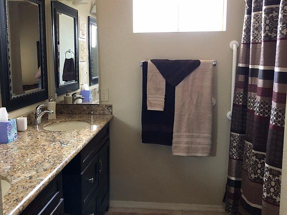 Master Bathroom with Handicapped grab bars including shower & toilet area
