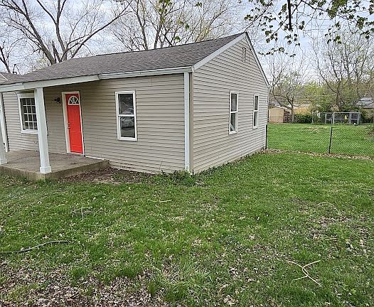 Side view of fenced yard