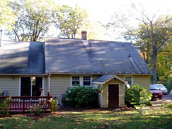 view of house in back in fall
