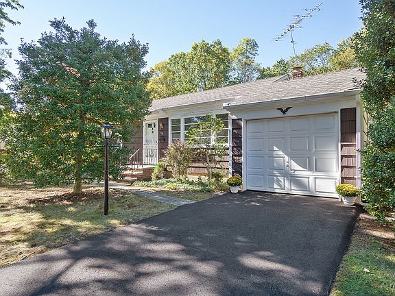 Another front view of home... new asphalt driveway
