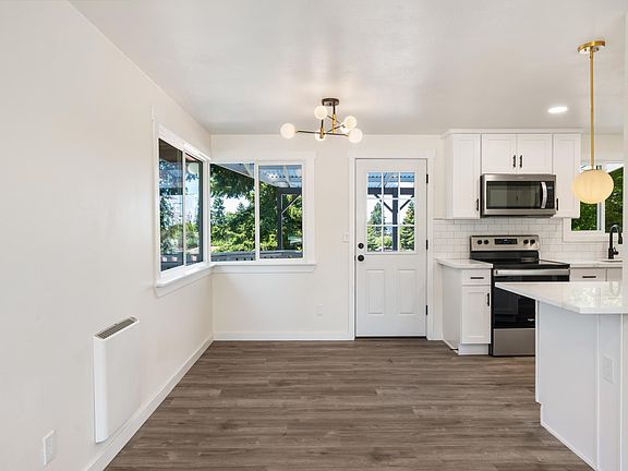 Dining area next to the kitchen with access to a spacious covered deck.