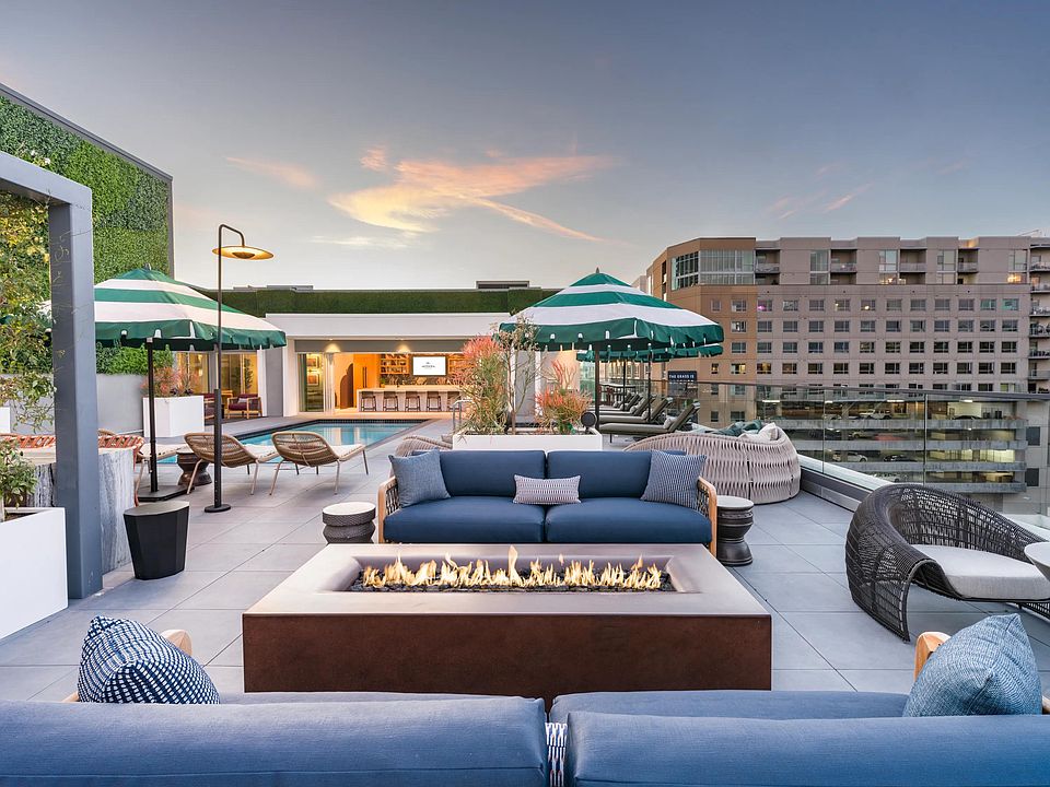 Relax in luxury at our resort-style rooftop pool with daybeds and sunshades!