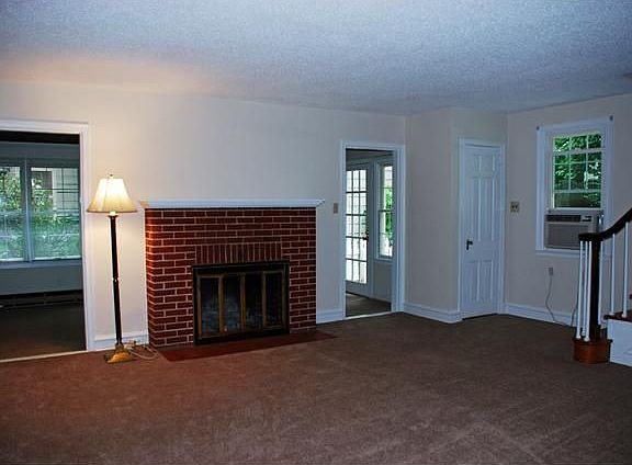 Living Room w/fireplace opens to Fla./Sunroom.