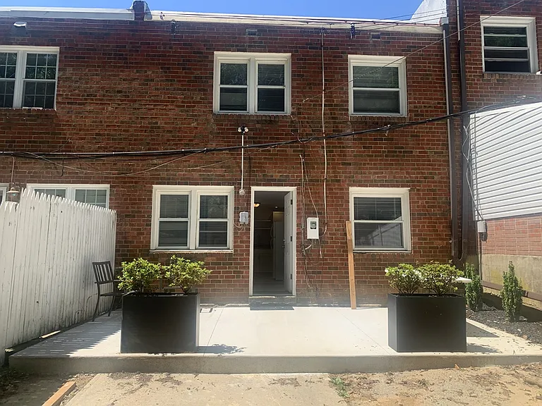 Rear of home with new patio and off street parking