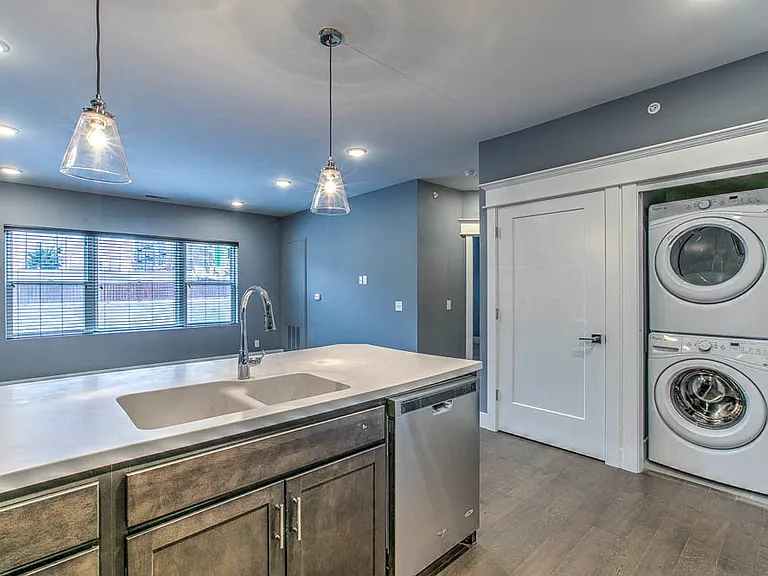 Smart layouts maximize space, featuring a streamlined kitchen, ample storage, and an in-home washer and dryer.