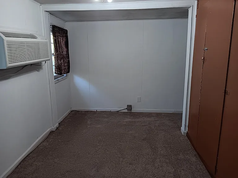 Living room as viewed from doorway to the bathroom