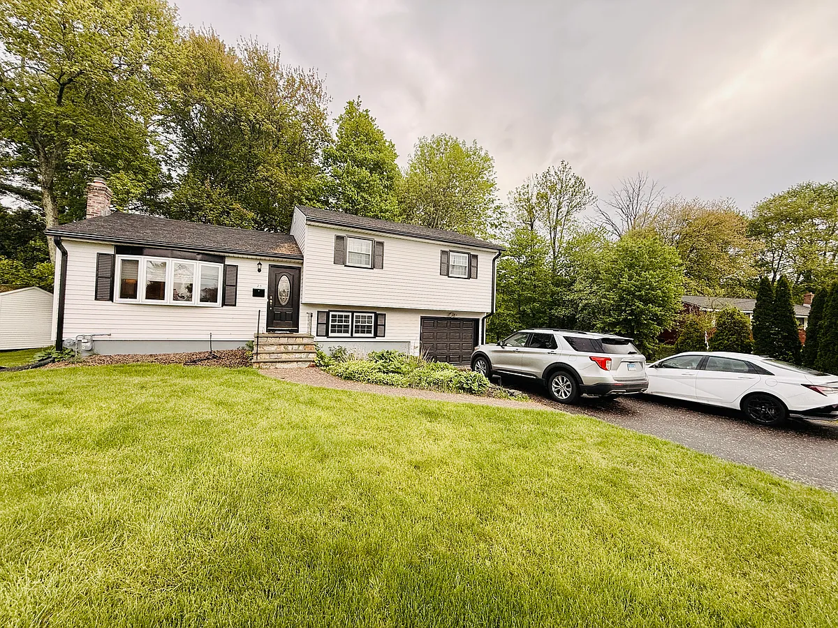 Driveway fits three cars. - 25 Kimberly Rd