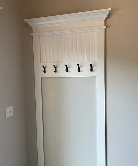 Coat rack off of entrance foyer