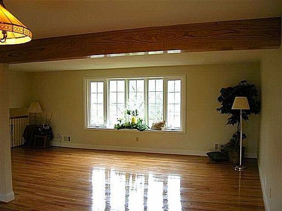 Livingroom.  Bay window and wood floors