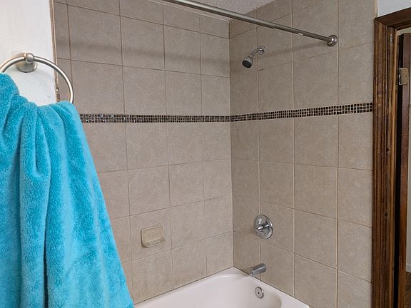 Tiled shower surrounds.