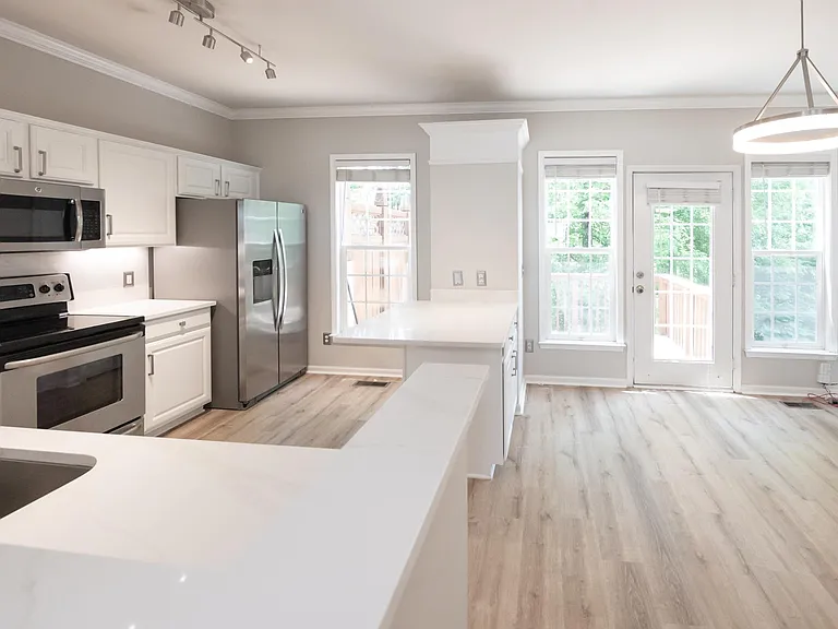 Full kitchen remodel with entryway to private patio.