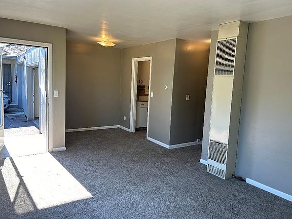 living room, hallway and entrance to kitchen