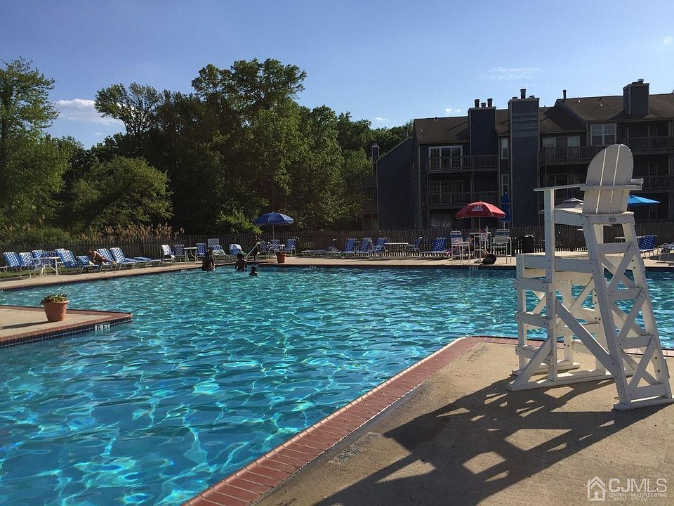 over-sized outdoor swimming pool with jacuzzi