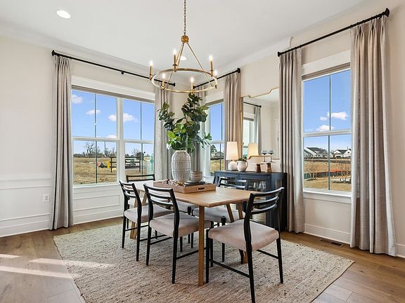 The dining room in the Matisse model single family home at Hiatt Pointe at Snowden Bridge by Brookfi