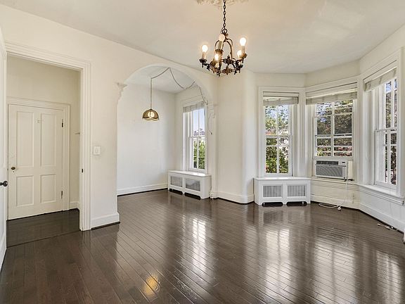 Hallway with Coat Closet, Dining Area, and Living Room.