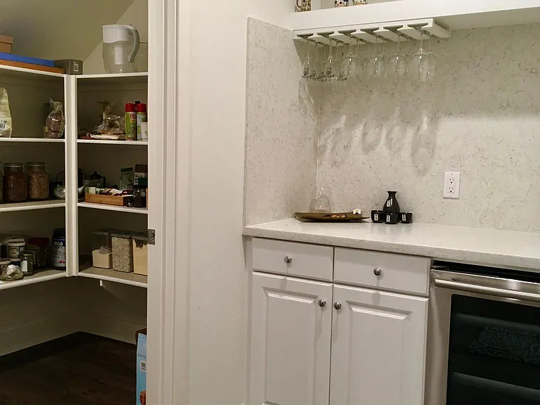 Large walk-in pantry and mini-bar with wine fridge
