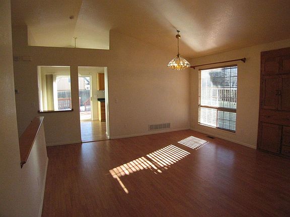 Looking from the vaulted ceiling dining to kitchen