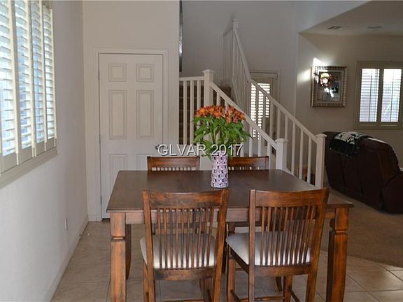 Separate dining area with tile flooring just steps from the kitchen and family room.