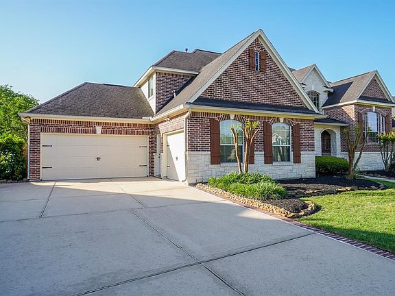 3-car garage and over-sized driveway with plenty of room for all of your vehicles