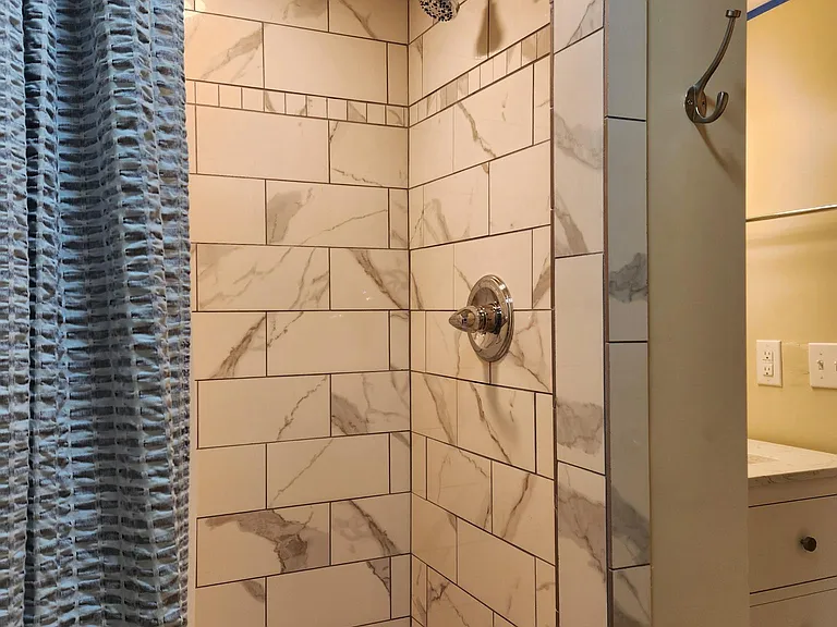 Custom tiled shower and floor.