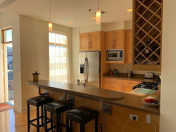 Large window in kitchen looks out to terrace.